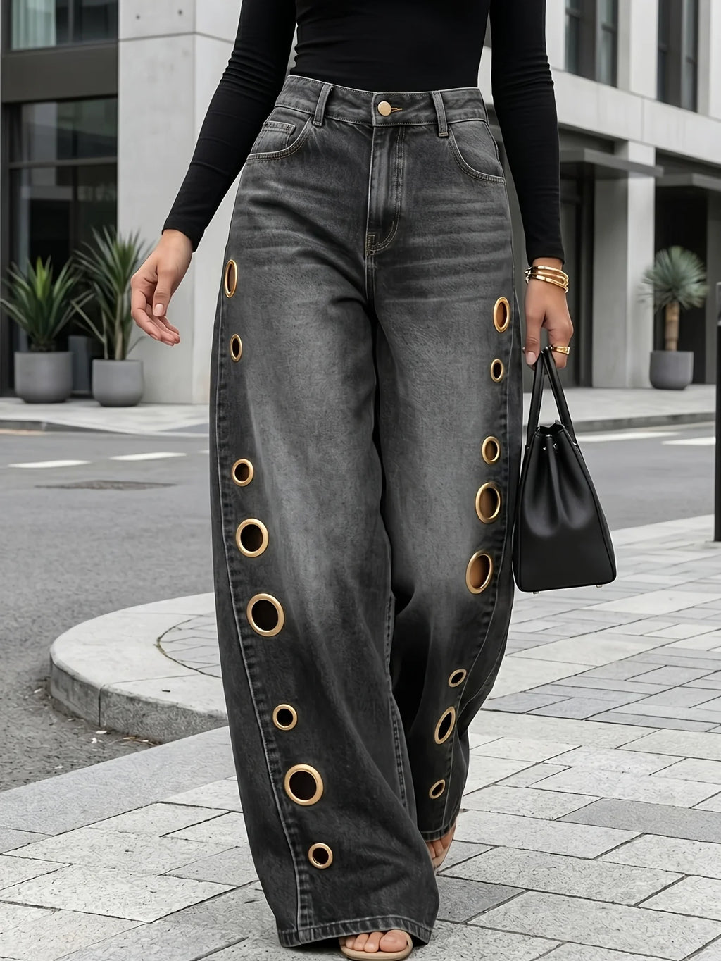 Wide-leg jeans with metallic eyelets