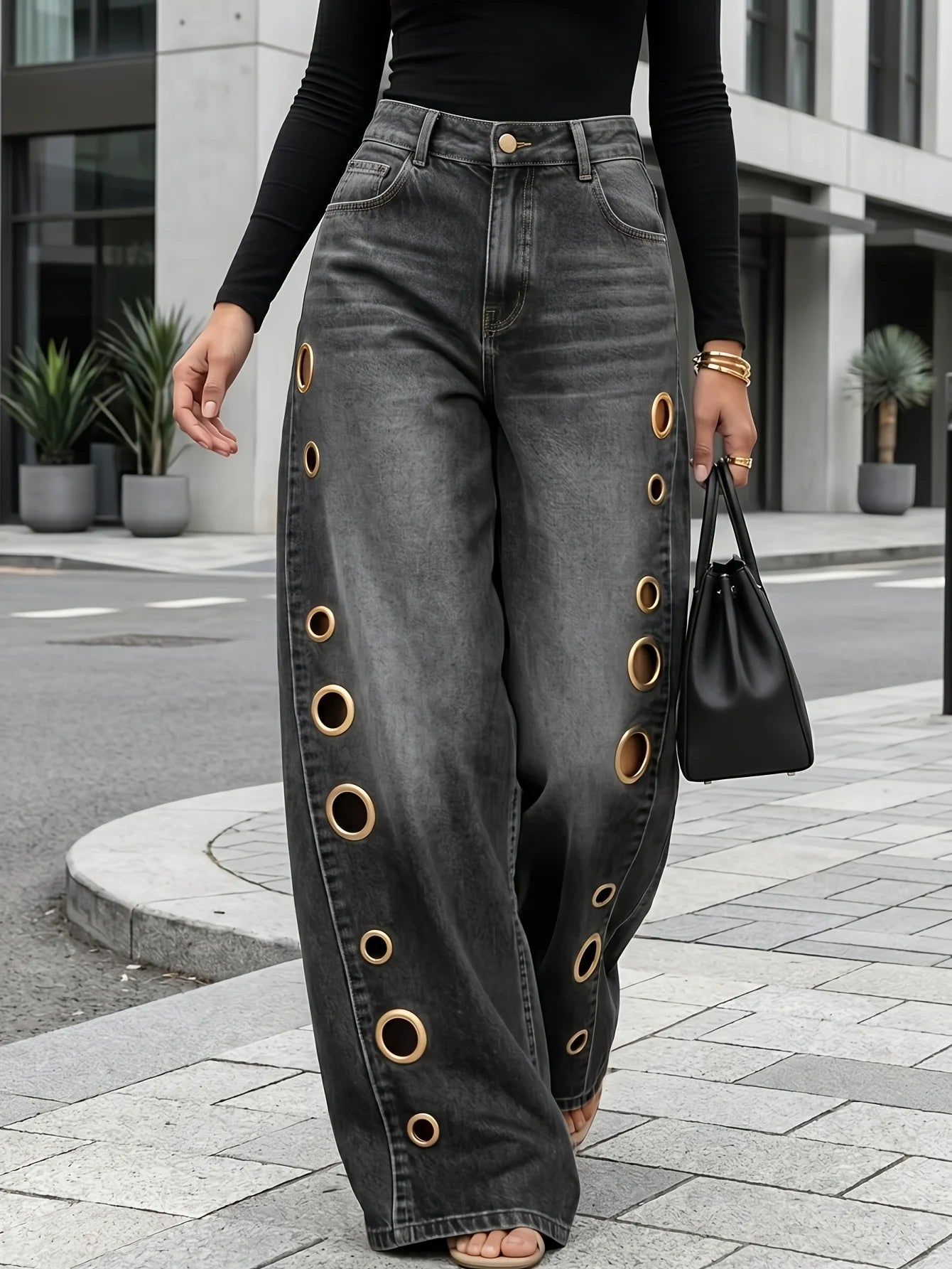 Wide-leg jeans with metallic eyelets