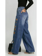 Wide-leg jeans with metallic eyelets
